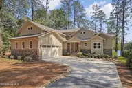 65 Lakeview Drive, Whispering Pines, NC 28327 — 3-bedroom waterfront home in Whispering Pines, Whispering Pines, NC, photo 1 of 75: Beautiful Waterfront Home