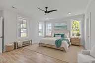 658 Fishermans Point, Newport, NC 28570 — 4-bedroom home in Bogue Watch, Newport, NC, photo 21 of 48: Coastal bedroom with ocean artwork (1)