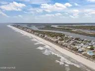 3909 W Beach Drive, Oak Island, NC 28465 — 4-bedroom waterfront home, Oak Island, NC, photo 23 of 52: 13-web-or-mls-DJI_20260408140502_0420_D