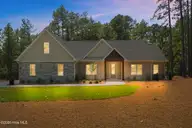 128 Banbridge Drive, Seven Lakes, NC 27376 — 4-bedroom home in Seven Lakes West, Seven Lakes, NC, photo 1 of 49: Front
