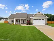 21 Oakbridge Way, Pikeville, NC 27863 — 3-bedroom home in Emerson Fields, Pikeville, NC, photo 2 of 31: 48-21 Oakbridge Way - Grass Fill