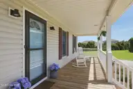 105 Franklin Court, Cedar Point, NC 28584 — 3-bedroom waterfront home in Cedar Point Beach, Cedar Point, NC, photo 13 of 53: 11 Inviting front porch