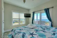 5103 W Beach Drive, Oak Island, NC 28465 — 4-bedroom waterfront home in W. Long Beach, Oak Island, NC, photo 22 of 65: 5103 W Beach Drive 21