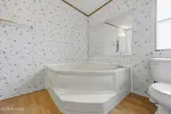 124 Zack Circle, Elizabeth City, NC 27909 — 3-bedroom manufactured home in Red Oak, Elizabeth City, NC, photo 17 of 36: Primary Ensuite Bathroom Tub