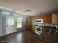 145 Cornerstone Place, Jacksonville, NC 28546 — 2-bedroom condo in Cornerstone Village, Jacksonville, NC, photo 4 of 20: Kitchen View 1