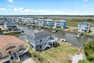 402 Dolphin Street, Sunset Beach, NC 28468 — 3-bedroom waterfront home, Sunset Beach, NC, photo 6 of 53: Spacious Homesite with Water Views