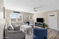 902 Ocean Drive E&W, Emerald Isle, NC 28594 — 4-bedroom home in Emerald Isle By The Sea, Emerald Isle, NC, photo 16 of 45: Living Room - East Side