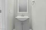 119 Pasture Lane B, Peletier, NC 28584 — 2-bedroom townhome in The Flatts at Coldwater Creek, Peletier, NC, photo 12 of 31: Half Bathroom