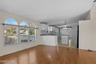 758 Wetherington Landing Road, Stella, NC 28582 — 3-bedroom manufactured home, Stella, NC, photo 12 of 49: Great room to kitchen