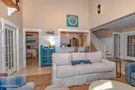 23 Ibis Roost, Bald Head Island, NC 28461 — 3-bedroom home in Ibis Roost, Bald Head Island, NC, photo 13 of 40: Living Room