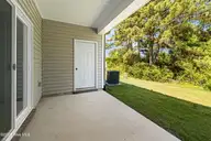 246 Cline Way Unit 122, Beaufort, NC 28516 — 3-bedroom townhome in 1809 Live Oak, Beaufort, NC, photo 23 of 44: Covered Patio with Storage