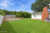 211 Vine Street, Beaufort, NC 28516 — 3-bedroom home in Jones Village, Beaufort, NC, photo 4 of 36: Fenced side yard and boat storage