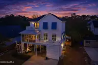 503 W Yacht Drive, Oak Island, NC 28465 — 4-bedroom home in Tranquil Harbor, Oak Island, NC, photo 4 of 53: Twilight front of home