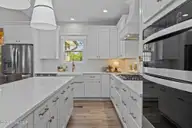 1240 Burning Tree Road, Pinehurst, NC 28374 — 4-bedroom home in Unit 12, Pinehurst, NC, photo 22 of 48: Wall Oven & Microwave