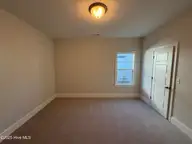 105 Flat Clam Drive, Wilmington, NC 28401 — 3-bedroom home in Riverside Cove, Wilmington, NC, photo 18 of 26: Guest Bed
