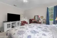 1310 Grandiflora Drive, Leland, NC 28451 — 4-bedroom home in Magnolia Greens, Leland, NC, photo 18 of 56: Primary Bedroom