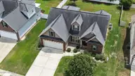 805 Megan Drive, Greenville, NC 27834 — 4-bedroom home in Mill Creek, Greenville, NC, photo 3 of 46: 49-web-or-mls-Drone 805 Megan Drive-3