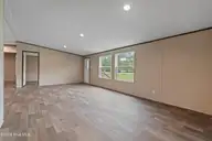 3080 Cross Street SW, Shallotte, NC 28470 — 3-bedroom manufactured home in Shell Point, Shallotte, NC, photo 5 of 35: Living Room