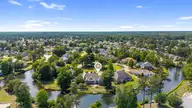 1232 Wood Lily Circle, Leland, NC 28451 — 4-bedroom waterfront home in Waterford of the Carolinas, Leland, NC, photo 18 of 56: 22_dji_20260504150511_0025_d