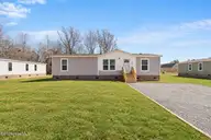6745 Lewis Drive SE, Winnabow, NC 28479 — 3-bedroom manufactured home in Lewis Acres, Winnabow, NC, photo 2 of 28: 6745 Lewis Dr