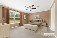 165 Godfrey Boulevard, Havelock, NC 28532 — 3-bedroom waterfront home in Godfreys Creek Estates, Havelock, NC, photo 15 of 52: Primary suite