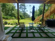 2659 Seashore Road SW, Supply, NC 28462 — 4-bedroom waterfront home in Gators Grant, Supply, NC, photo 14 of 75: Grill and Patio area
