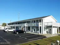 127 Old Causeway Road 21, Atlantic Beach, NC 28512 — 1-bedroom waterfront condo in Pirates Den, Atlantic Beach, NC, photo 1 of 17: exterior bldg 2