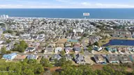 717 Settlers Lane, Kure Beach, NC 28449 — 4-bedroom waterfront home in Kure Beach Village, Kure Beach, NC, photo 6 of 69: mls_717_Settlers_Ln_-_Drone_Photos_011 c