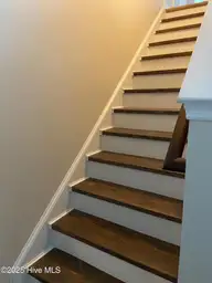309 Basil Court, Hubert, NC 28539 — 3-bedroom home in Sagewood, Hubert, NC, photo 10 of 27: 309 basil stairs