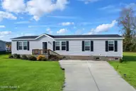 127 Wildflower Way, Stella, NC 28582 — 4-bedroom manufactured home in Stella Farms, Stella, NC, photo 1 of 15: 127 Wildflower Way