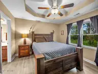 423 Blue Pennant Court, Sneads Ferry, NC 28460 — 3-bedroom home in Oyster Landing, Sneads Ferry, NC, photo 22 of 35: Primary Bedroom