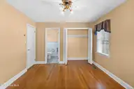 129 Pineland Avenue, Mount Olive, NC 28365 — 3-bedroom home in College Heights, Mount Olive, NC, photo 14 of 27: Primary Bedroom w/half bath