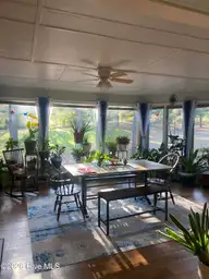36 Martin Drive Unit D, Whispering Pines, NC 28327 — 2-bedroom condo in Tanglewood, Whispering Pines, NC, photo 1 of 10: 36 martin drive-sunroom
