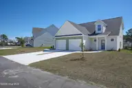 215 Sandpiper Place, Holly Ridge, NC 28445 — 3-bedroom townhome in Coastal Village, Holly Ridge, NC, photo 2 of 20: 213.215 Sand Piper - Exterior - Edited_1