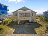 2011 W Beach Drive, Oak Island, NC 28465 — 4-bedroom waterfront home in W. Long Beach, Oak Island, NC, photo 3 of 51: 12-web-or-mls-DJI_20251031125539_0308_D