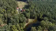 104 Bridle Path Lane, Carthage, NC 28327 — 3-bedroom waterfront home in Carolina Equest, Carthage, NC, photo 1 of 64: DJI_20250924102824_0269_D