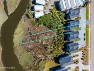 825a N New River Drive, Surf City, NC 28445 — 4-bedroom waterfront townhome, Surf City, NC, photo 2 of 49: 038_dji_20261001120151_0102_dp_915