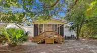 3215 Herthwood Place SW, Supply, NC 28462 — 3-bedroom waterfront manufactured home in West Tanglewood, Supply, NC, photo 20 of 36: back porch