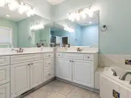 129 Sunset Drive, Cedar Point, NC 28584 — 3-bedroom waterfront home in Plantation Shores, Cedar Point, NC, photo 15 of 46: 016-1280x960-master-bathroom
