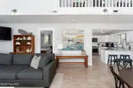 1707 S Shore Drive, Surf City, NC 28445 — 3-bedroom waterfront home in White Hills Beach, Surf City, NC, photo 16 of 65: living-room-01b
