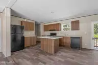 580 S Windward Drive SW, Supply, NC 28462 — 3-bedroom manufactured home in Ocean Trail II, Supply, NC, photo 8 of 32: Kitchen