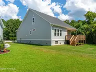 116 Scouts Bend Road, Beaufort, NC 28516 — 3-bedroom home in Beaufort Club, Beaufort, NC, photo 17 of 34: Deck overlooking Backyard