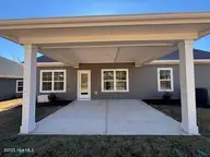 114 Firethorn Circle, Wallace, NC 28466 — 4-bedroom home in River Landing, Wallace, NC, photo 18 of 50: Covered patio