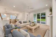 1217 Rockhill Road, Castle Hayne, NC 28429 — 3-bedroom waterfront home in Sunset Reach, Castle Hayne, NC, photo 8 of 75: SR42R Living to Dining and Porch