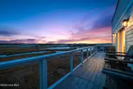 321 N New River Drive, Surf City, NC 28445 — 6-bedroom waterfront home, Surf City, NC, photo 6 of 73: 321NNewRiver_Deck_Dusk_01