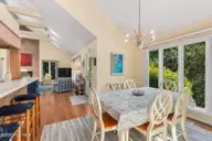 579 Coral Ridge Road, Pine Knoll Shores, NC 28512 — 4-bedroom waterfront home in Beacon's Reach, Pine Knoll Shores, NC, photo 16 of 62: Open Dining & Living Area