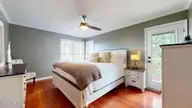 9124 Riverview Drive, New Bern, NC 28560 — 3-bedroom waterfront condo in Fairfield Harbour, New Bern, NC, photo 11 of 50: Primary Bedroom w/deck access