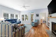 121 Sea Isle North Drive & Slip 20, Indian Beach, NC 28512 — 3-bedroom waterfront home in Sea Isle Plantation North, Indian Beach, NC, photo 10 of 53: Living room with porch access