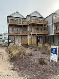 126 Shell Road, Surf City, NC 28445 — 3-bedroom waterfront townhome in Dune Ridge, Surf City, NC, photo 2 of 43: 126 Shell Front with my sign