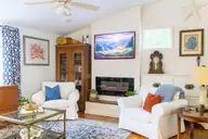 7908 E Yacht Drive, Oak Island, NC 28465 — 2-bedroom waterfront home in Tranquil Harbor, Oak Island, NC, photo 6 of 25: den fireplace